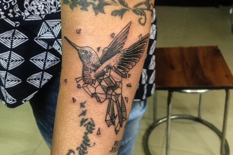 Amazing geometric bird tattoo done by bobby at best permanent tattoo shop;